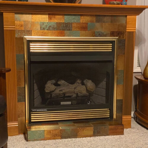 bronze cooper subway tile fireplace